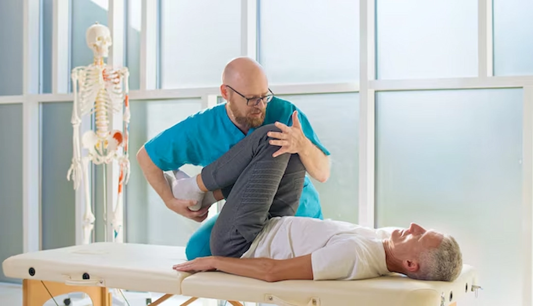 Physiotherapy therapist assisting patient in Doha.