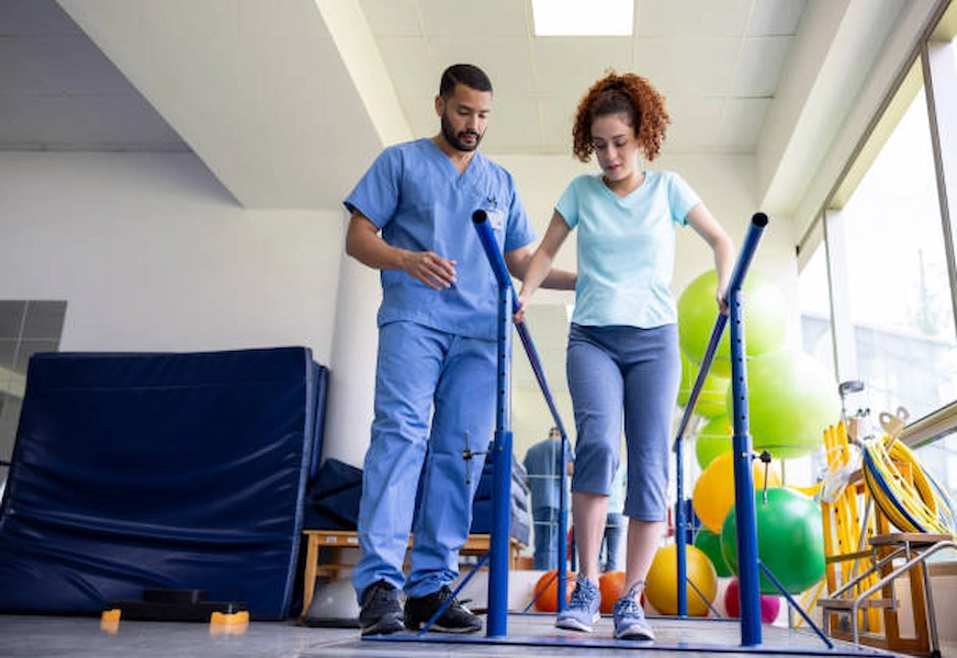 Dedicated physiotherapist assisting a patient in Doha.