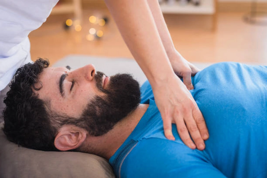 Patient receiving chest physiotherapy for better breathing.