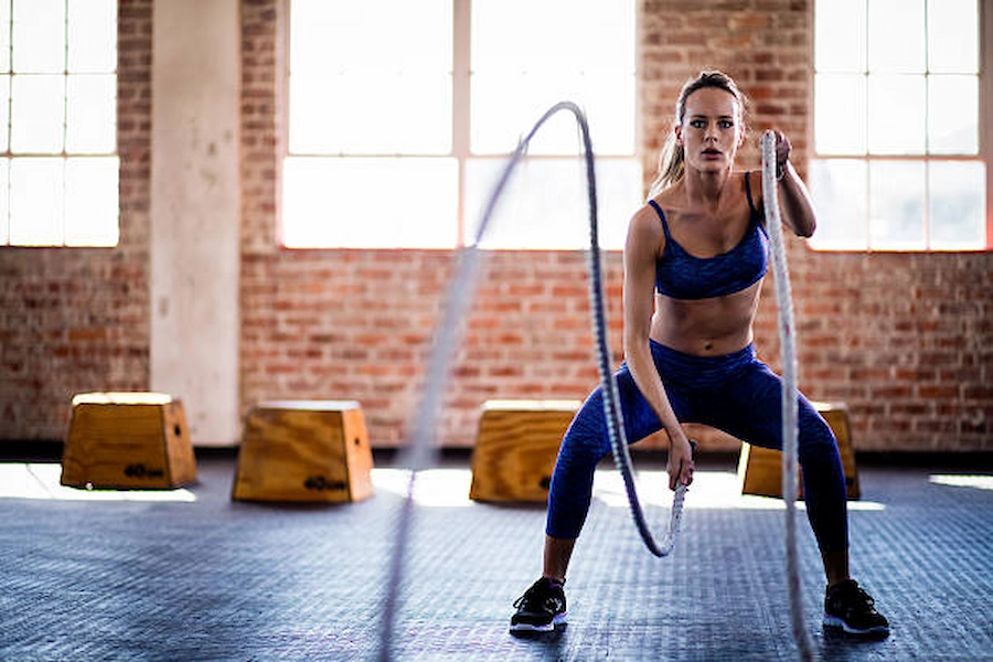 Strong women lifting weights in a fitness class.