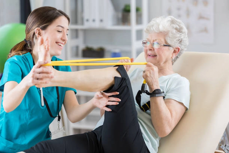 Patient engaged in knee therapy exercises.