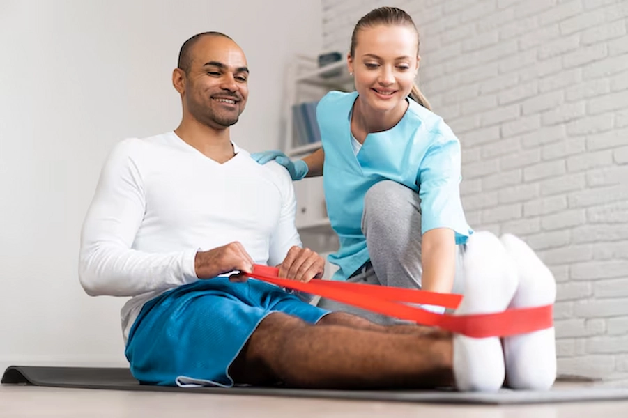 Physical therapist assisting patient during rehabilitation session.