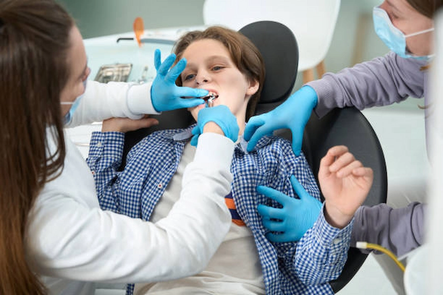 Professional tooth extraction care at ATOS Medical Center.