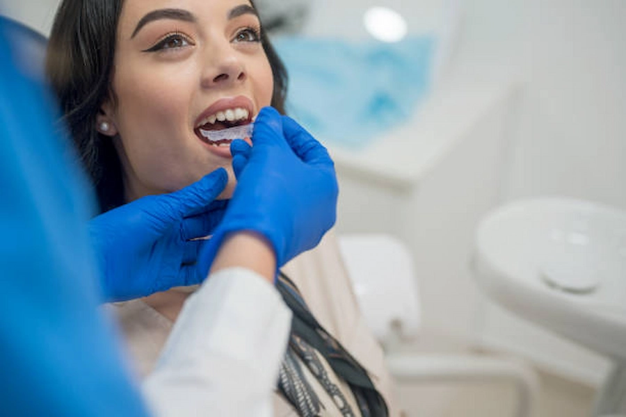 Happy patients receiving orthodontic care at ATOS.