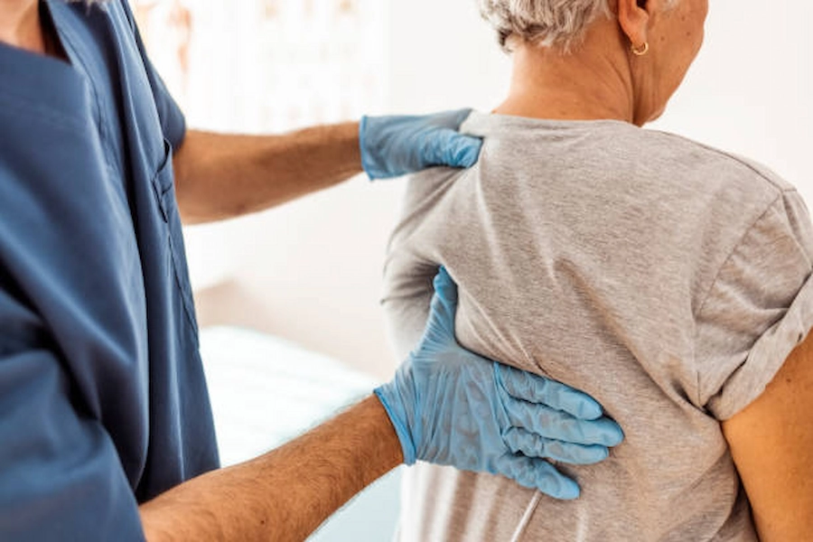 Patient receiving spinal care and support services.